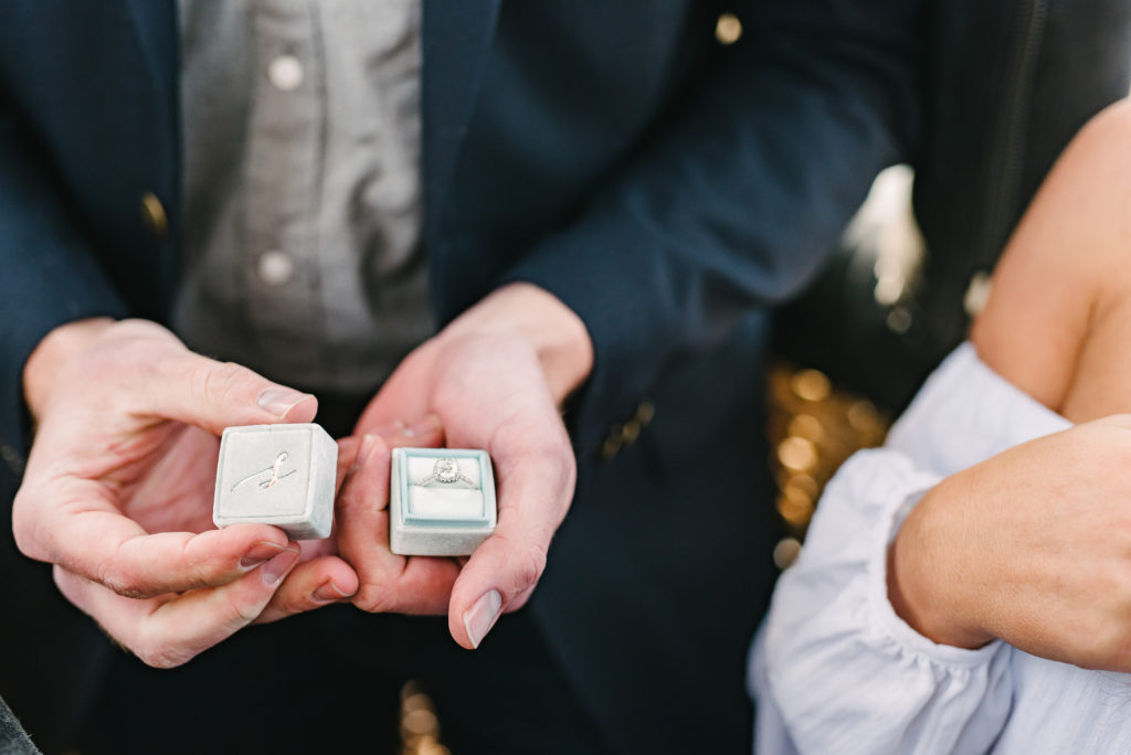 Man displays the custom-engraved Mrs. Box velvet ring box he purchased for his San Diego Proposal. 