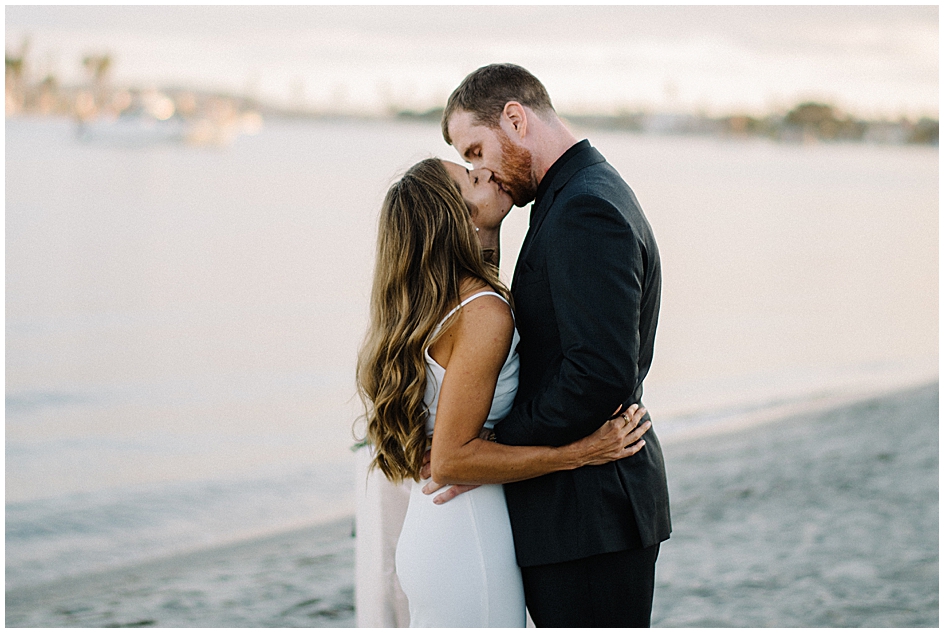 San Diego Microwedding Photographer Marie Monforte captures the bride and groom's first kiss at their Pacific Beach Microwedding during the Coronavirus pandemic. 