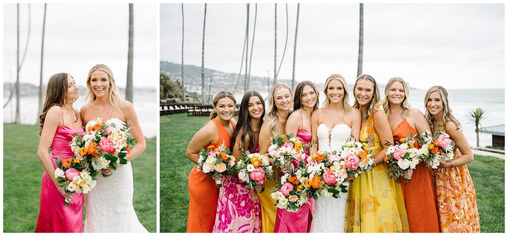 A bride smiles and stands next to her 7 bridesmaids, all wearing pink, yellow, and orange dresses on a field next to the ocean. 
